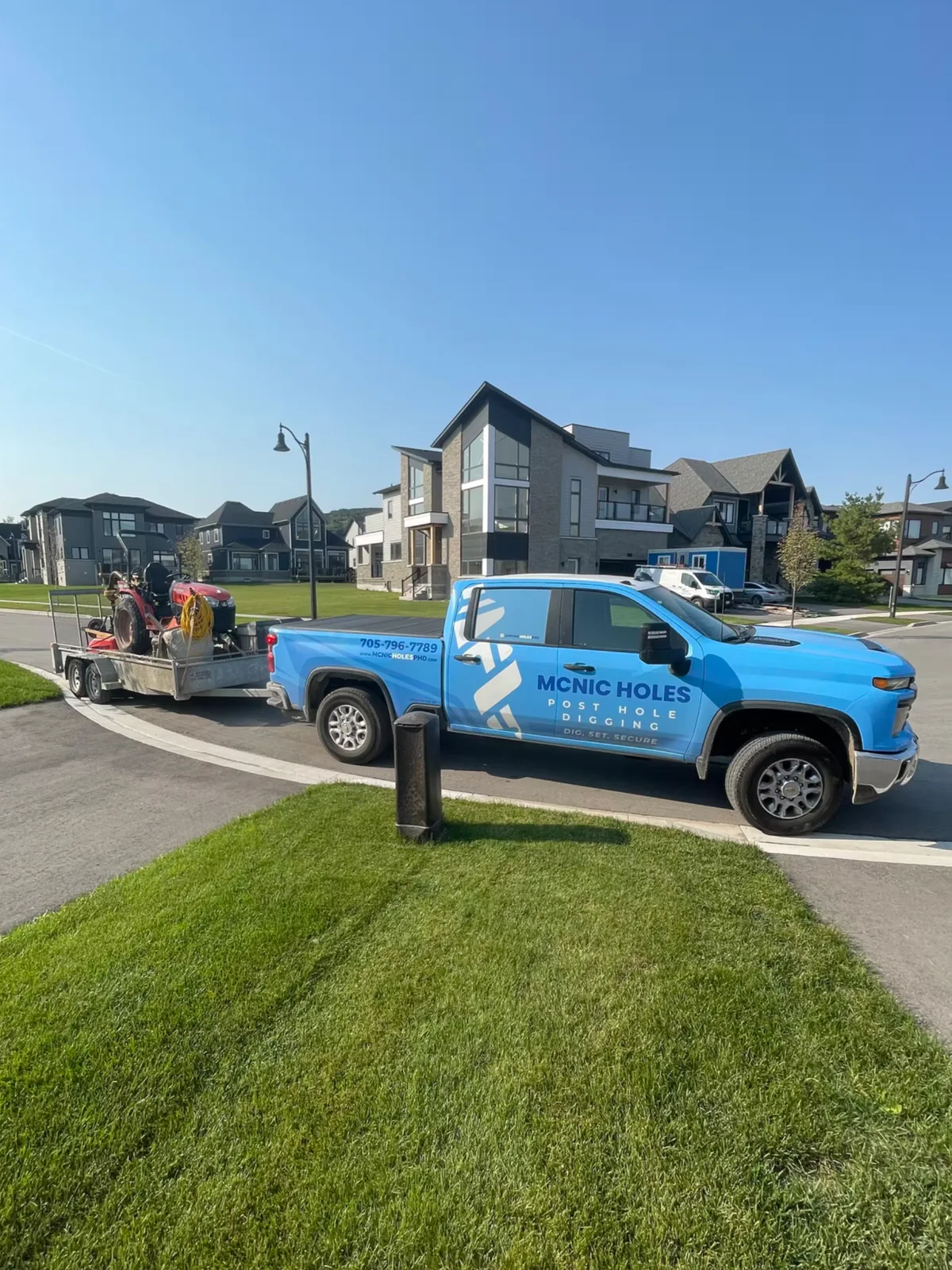 Post hole digging and fence building equipment on the jobsite
