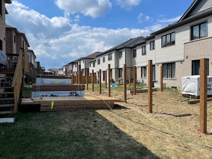 Fence posts dug and set in concrete for a subdivision in Wasaga Beach